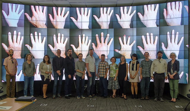 Group in front of LCD wall