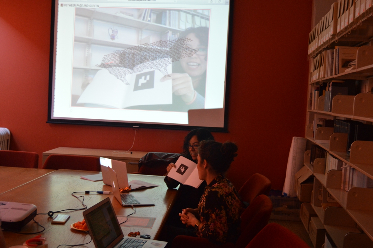 photo: Alex Saum-Pascual and Élika Ortega demonstrate Between Page and Screen by Amaranth Borsuk and Brad Bouse