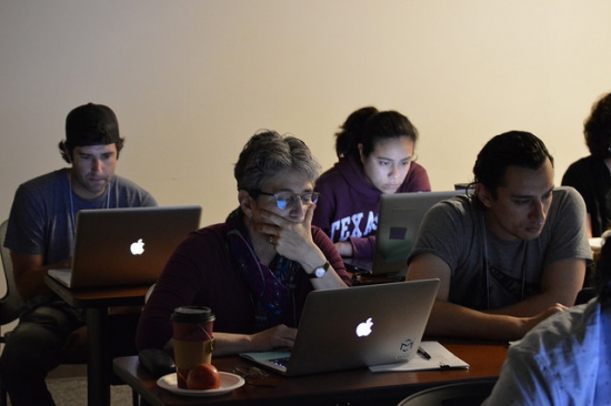 Students looking at laptops intently