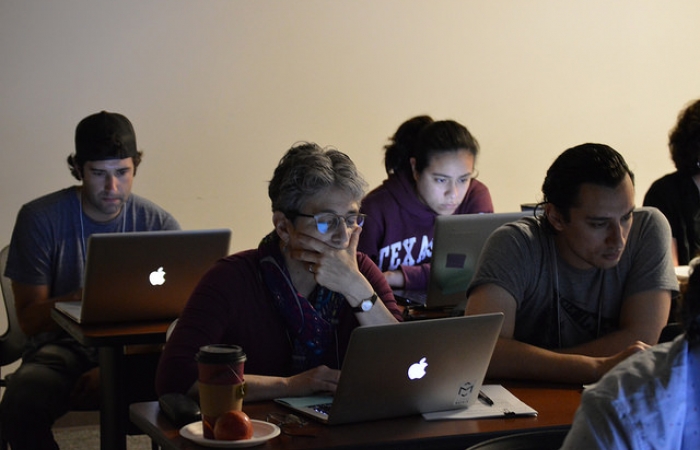 Students looking at laptops intently