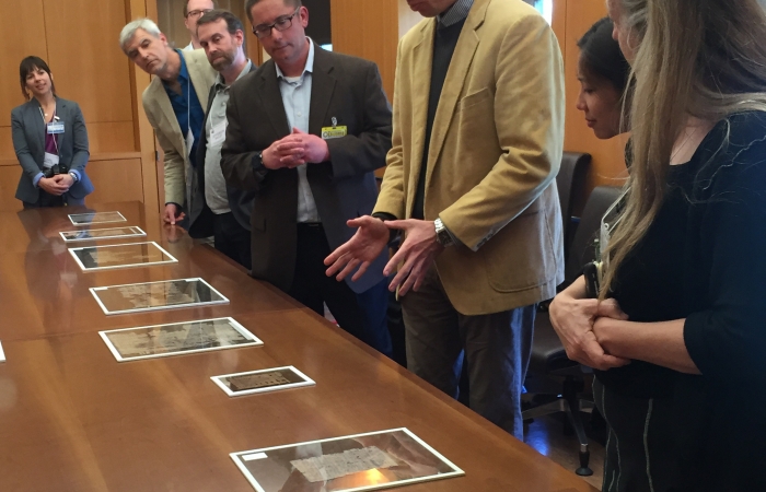 Photo: Michael Zellmann-Rohrer exhibits papyrus fragments at the Bancroft Library